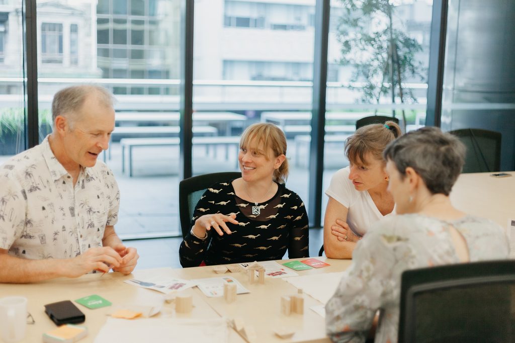 Four work colleagues play Taurite.